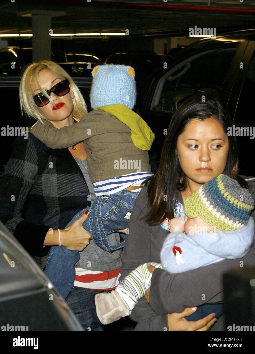 The work never ends for doting mom Gwen Stefani. She toted her two sons, Zuma, 3 months, and Kingston, 2, to the doctor today and stopped in at a pharmacy afterwards, clutching a small prescription bag as she left. Now that baby Zuma is getting older, Stefani is making plans to head back to work. Gwen's group, No Doubt, announced on its Website recently that they'll be touring in 2009 in support of their first new album in seven years. Meanwhile, reports are that Stefani is 'annoyed' that husband Gavin included a duet, 'Some Days,' the two recorded for fun on his new album 'Wanderlust.' Los An Stock Photo