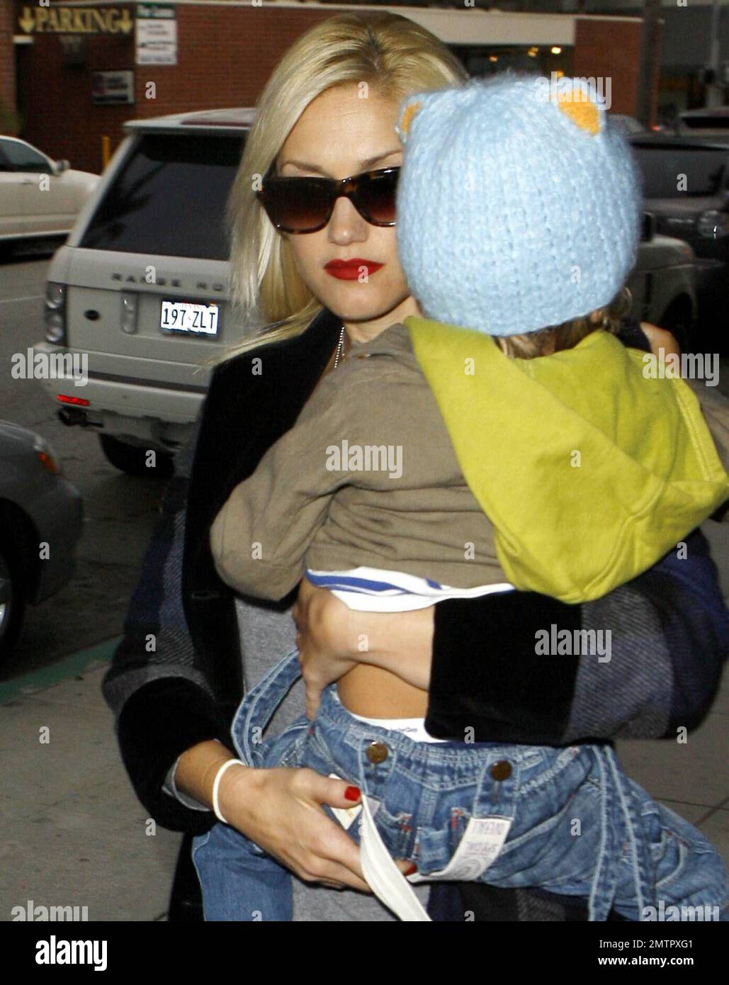 The work never ends for doting mom Gwen Stefani. She toted her two sons, Zuma, 3 months, and Kingston, 2, to the doctor today and stopped in at a pharmacy afterwards, clutching a small prescription bag as she left. Now that baby Zuma is getting older, Stefani is making plans to head back to work. Gwen's group, No Doubt, announced on its Website recently that they'll be touring in 2009 in support of their first new album in seven years. Meanwhile, reports are that Stefani is 'annoyed' that husband Gavin included a duet, 'Some Days,' the two recorded for fun on his new album 'Wanderlust.' Los An Stock Photo