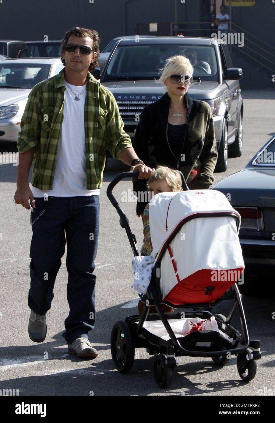 Gwen Stefani and Gavin Rossdale take sons Kingston and baby Zuma on a family shopping outing, stopping in at a local gourmet food store and at a Lakeshore Learning Materials store nearby. Little Zuma napped in his stroller while Kingston rode along, standing on a platform attached to the back. After shopping at Lakeshore, Gavin pushed a cart overflowing with bags of goodies from Lakeshore as Gwen took care of getting the kids back to the car. Los Angeles, CA. 11/29/08. Stock Photo