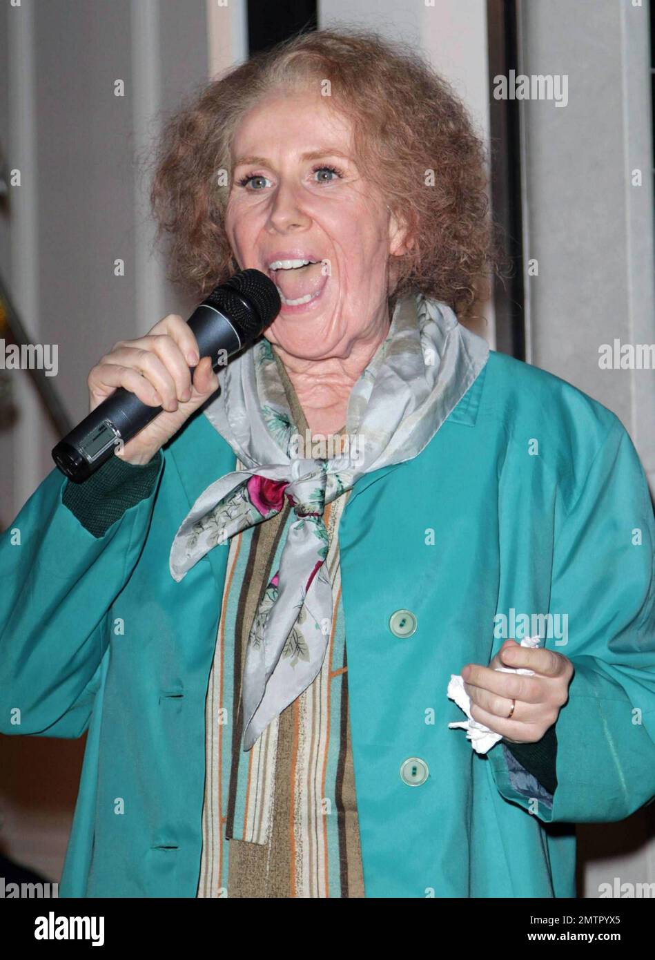 Catherine Tate performs as the character Joannie "Nan" Taylor, who she plays on her comedy program "The Catherine Tate Show," as she lights the Christmas lights at the Stella McCartney store. London, UK. 11/22/10. Stock Photo