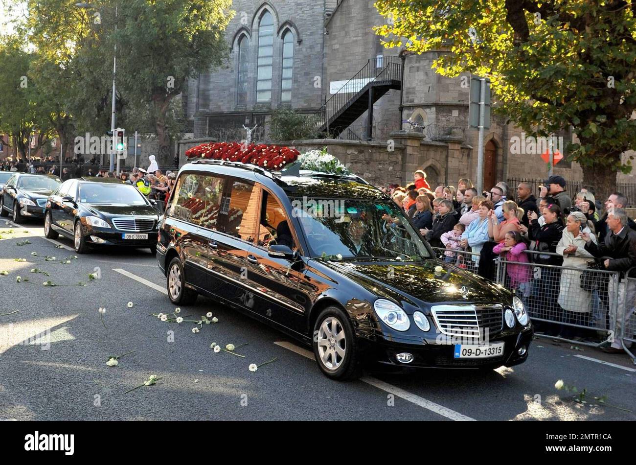 Stephen Gately's funeral procession makes its way through the streets of Dublin after Gately's funeral at St. Laurence O'Toole's Church. The streets are lined with fans and well-wishers who throw white roses at the passing procession. A founding member of Ireland's first boy band, Boyzone, Stephen Gately was found dead at the age of 33 while on holiday in Majorca. It's reported that an autopsy revealed that Stephen died from acute pulmonary oedema, a buildup of fluid in his lungs. Gately was a champion of gay rights after coming out in 1999 and entered into a civil union with Andrew Cowles in Stock Photo