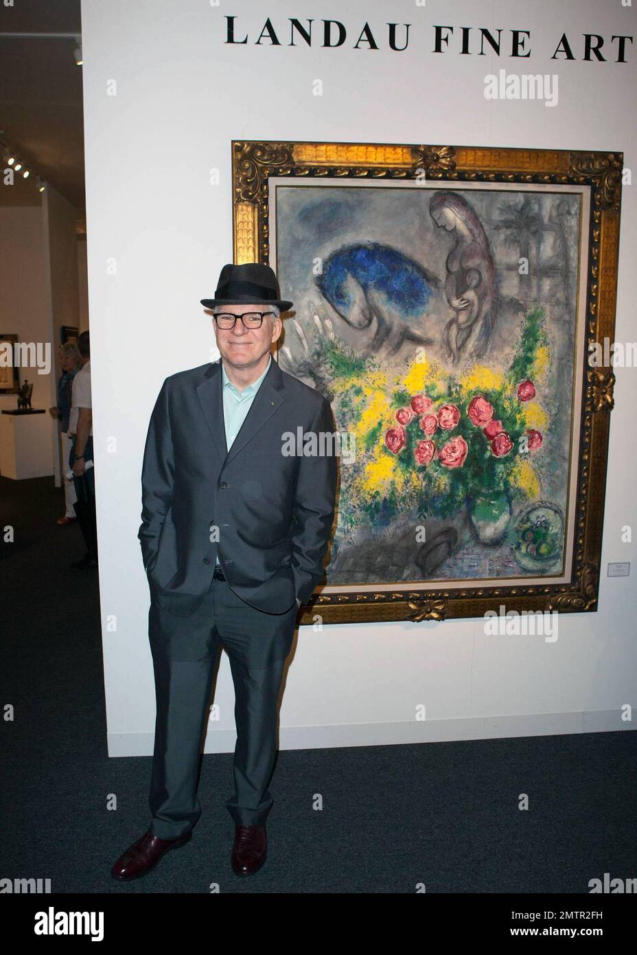 Actor, comedian and musician Steve Martin poses for photos while ...