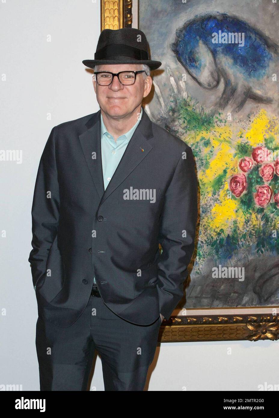 Actor, comedian and musician Steve Martin poses for photos while ...