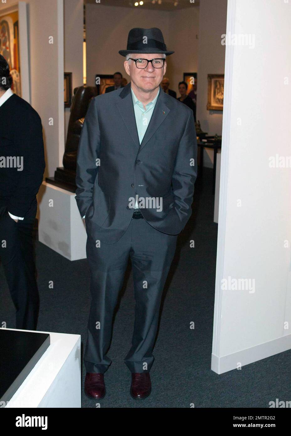 Actor, comedian and musician Steve Martin poses for photos while ...