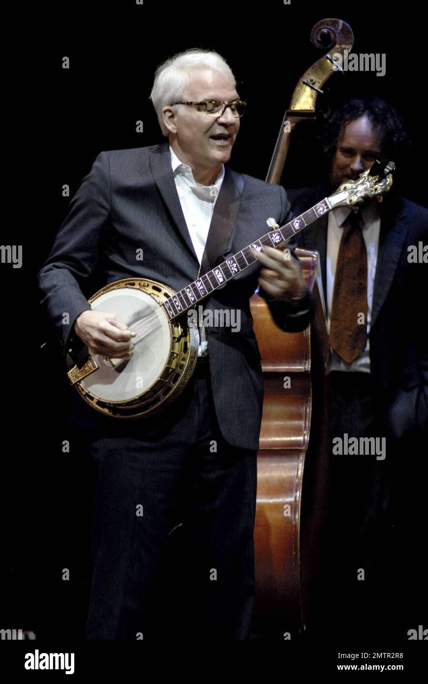 Actor, comedian and musician Steve Martin performs live alongside the Steep Canyon Rangers at 'A Tentative Evening of Bluegrass with Steve Martin' at the Rubin Museum. Martin recently released a bluegrass album 'The Crow: New Songs for the Five-String Banjo' which features guest appearances from bluegrass heavyweights such as Dolly Parton and Vince Gill. New York, NY. 5/28/09. Stock Photo