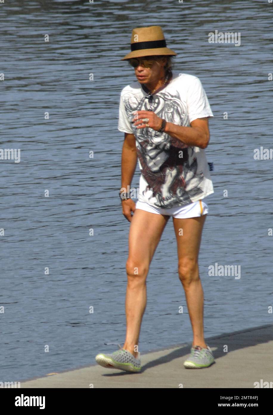 Sixty three-year-old "American Idol" judge and Aerosmith rocker Steven  Tyler goes casual in a t shirt and some very short shorts that show his  slim legs as he heads out for a