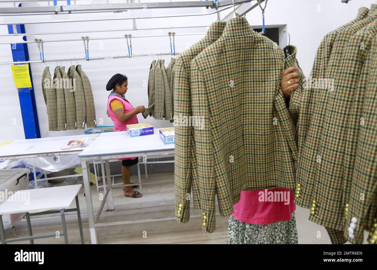 Sri Lankan women work at a garment factory in country's largest export