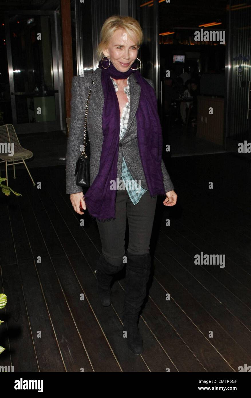 Musician Sting Gordon Sumner leaves Cafe Habana wearing bookish glasses and a scarf after dining there with his wife producer Trudie Styler. The couple who have been married for 18 years and