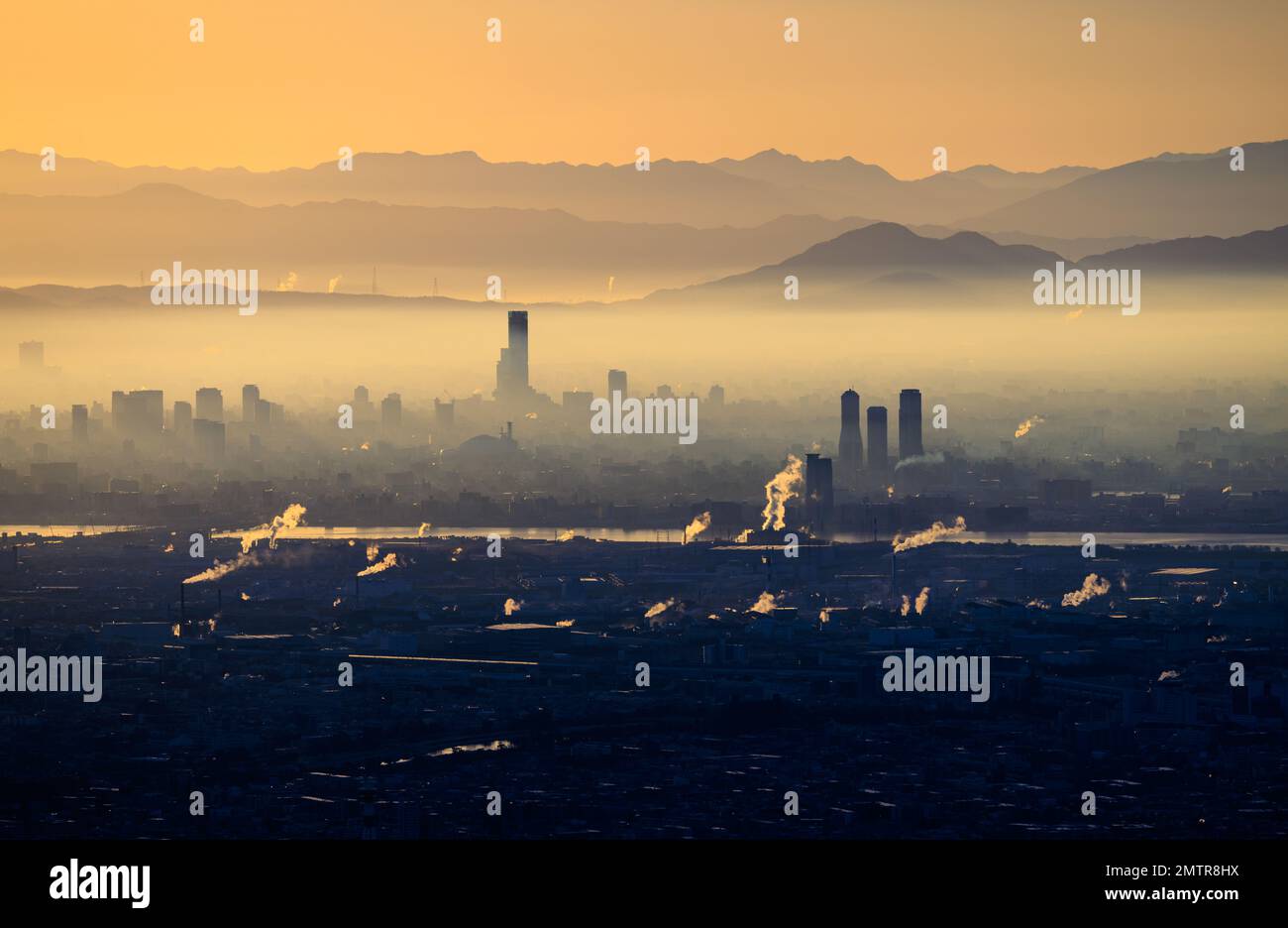 Thick layer of haze over industrial city at sunrise Stock Photo Alamy