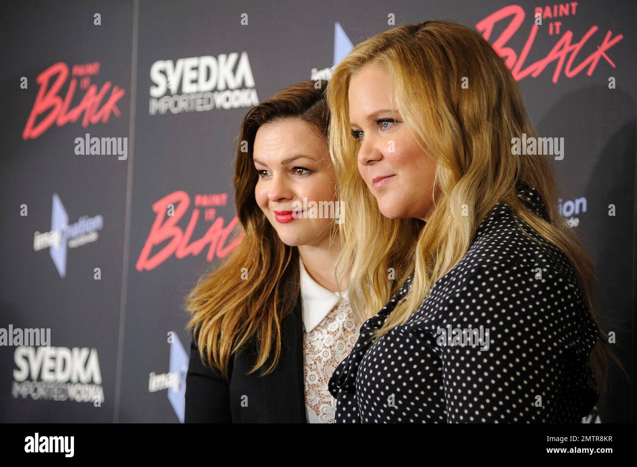 Amber Tamblyn, left, and Amy Schumer attend the premiere of "Paint It