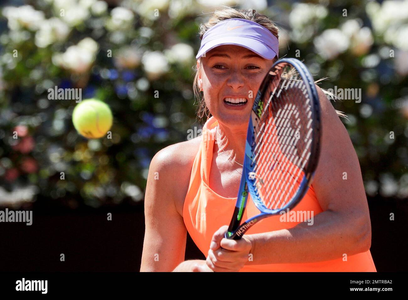 Maria Sharapova, of Russia, returns the ball to Christina Mchale, of