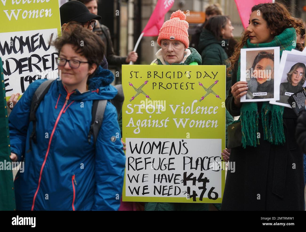People attend a St Brigid's Day rally outside Leinster House, Dublin, calling on the Government to take action in addressing violence against women in Ireland. The rally was held to coincide with St Brigid’s Day, with speakers asking that women be protected in the spirit of the Celtic goddess and Christian saint Brigid, who is associated with healing. Picture date: Wednesday February 1, 2023. Stock Photo