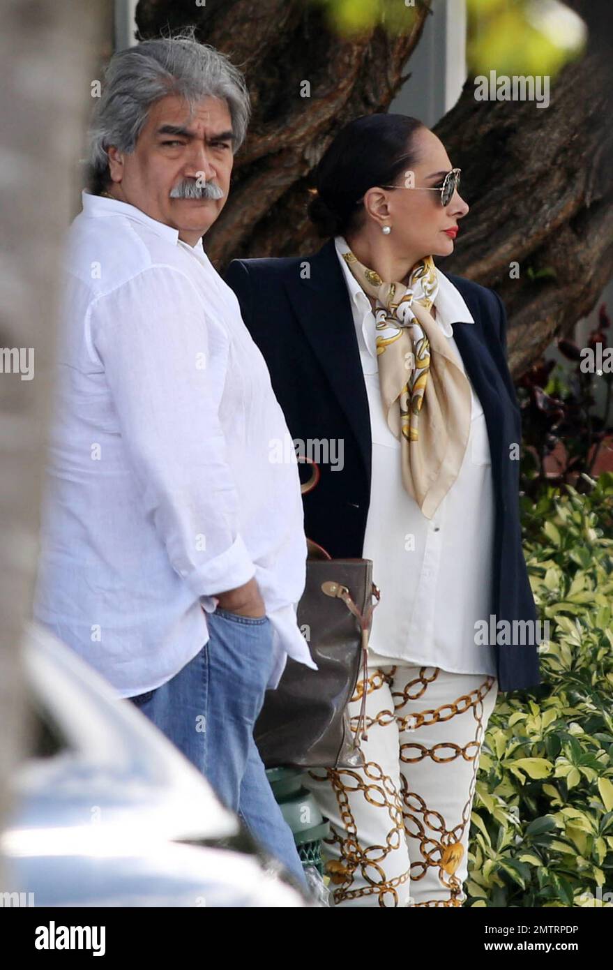 EXCLUSIVE!! Paulina Rubios mother, Susana Dosamantes, is spotted out and  about in Miami with her husband, Paulinas stepfather. The 66 year old  legendary Mexican actress wore a black blazer over a white