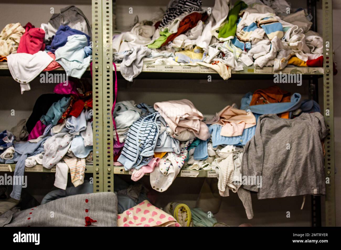 Humanitarian aid station, interior of industrial warehouse with used