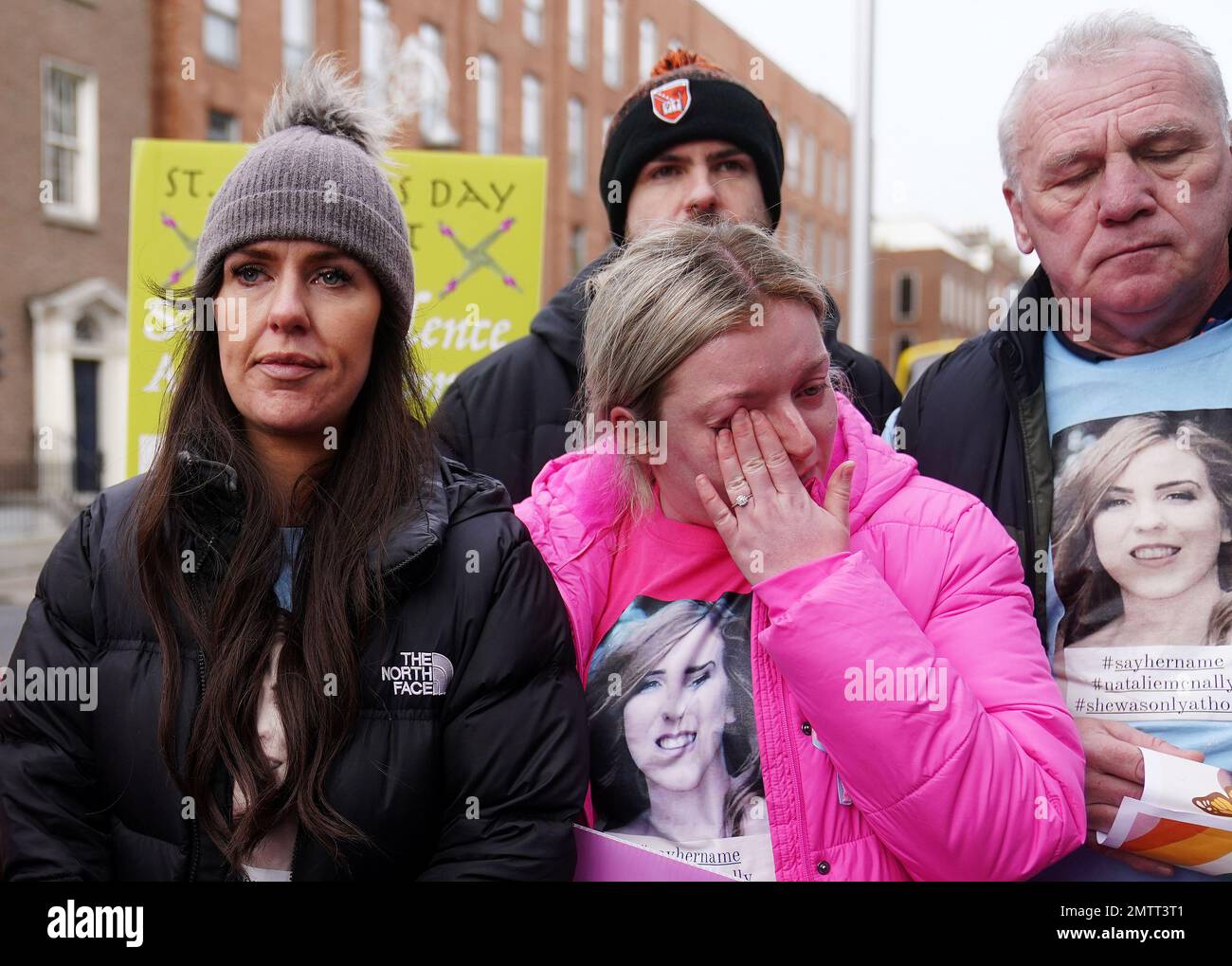 Family members of murder victim Natalie McNally Gemma Doran (left), and Hollie Donnelly (centre) attend a St Brigid's Day rally outside Leinster House, Dublin, calling on the Government to take action in addressing violence against women in Ireland. The rally was held to coincide with St Brigid’s Day, with speakers asking that women be protected in the spirit of the Celtic goddess and Christian saint Brigid, who is associated with healing. Picture date: Wednesday February 1, 2023. Stock Photo