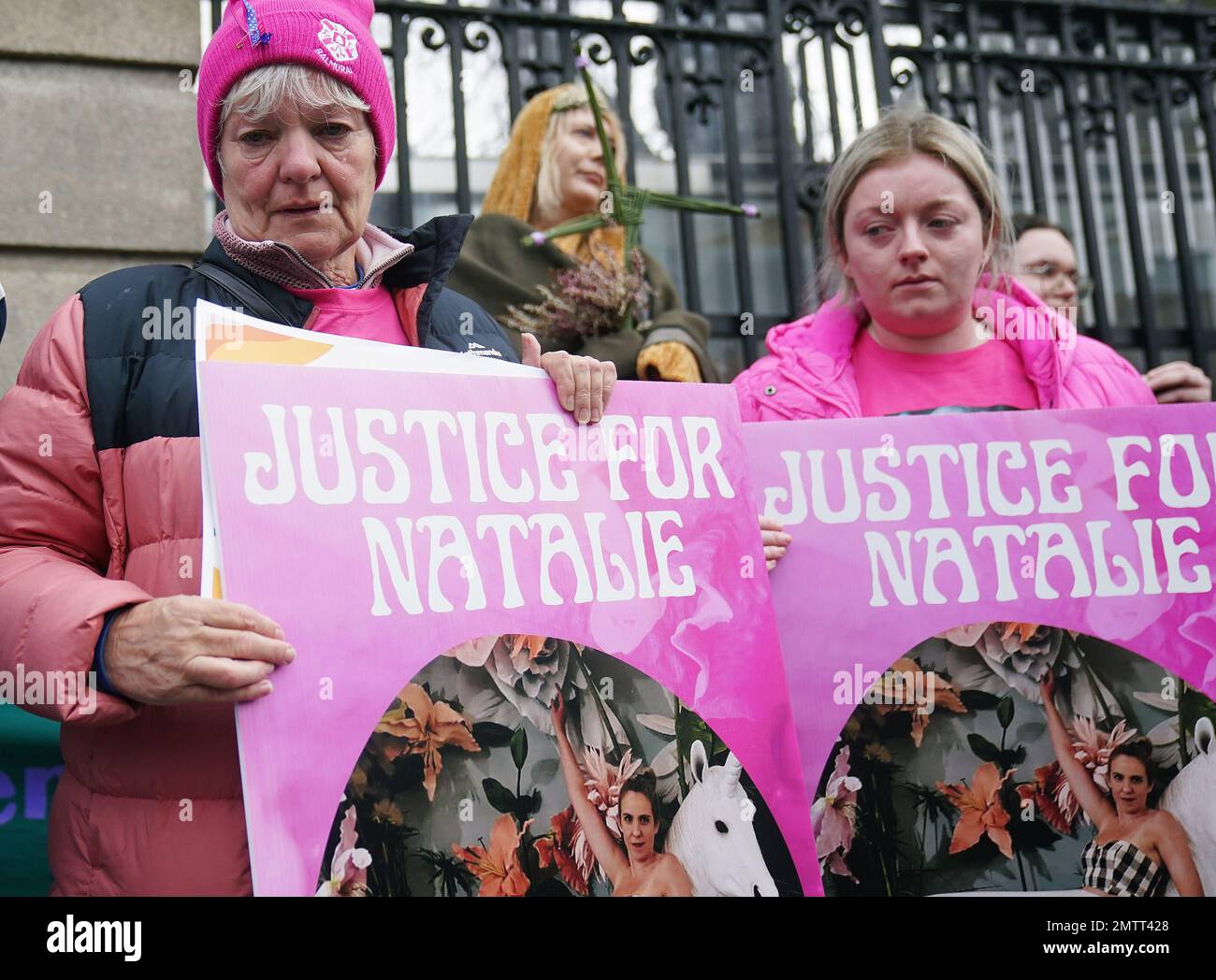 Family members of murder victim Natalie McNally Bernie McNally (left) and Hollie Donnelly (right) attend a St Brigid's Day rally outside Leinster House, Dublin, calling on the Government to take action in addressing violence against women in Ireland. The rally was held to coincide with St Brigid’s Day, with speakers asking that women be protected in the spirit of the Celtic goddess and Christian saint Brigid, who is associated with healing. Picture date: Wednesday February 1, 2023. Stock Photo