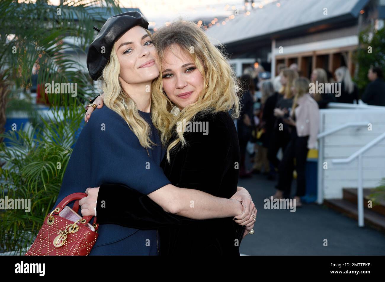 Actresses Jaime King and Juno Temple pose together at the Dior Cruise