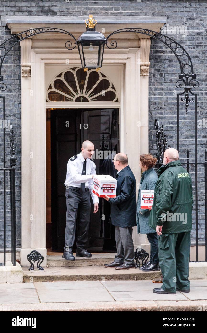 Downing Street, London, UK. 1st February 2023. Paul Nowak, General Secretary, TUC, hands in a petition, signed by more than 200,000 people, opposing the new legislation on strikes, to Number 10 Downing Street  Eddie Brand, Branch Secretary, Unison, London Ambulance Service,  Paul Nowak, General Secretary, TUC, Kate Bell, Assistant General Secretary, TUC,     Photo by Amanda Rose/Alamy Live News Stock Photo