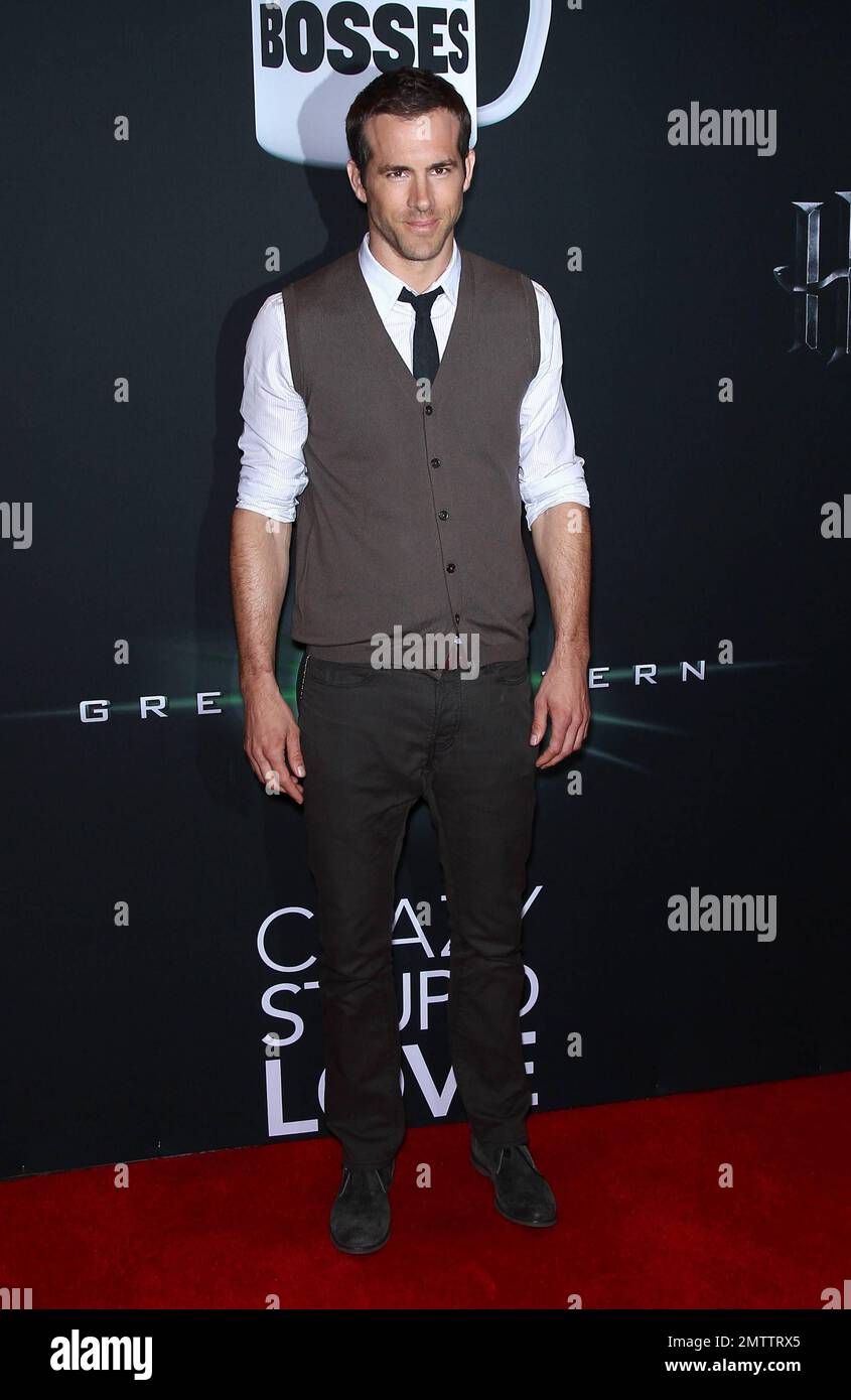 "Green Lantern" actor Ryan Reynolds poses for photographers at Warner