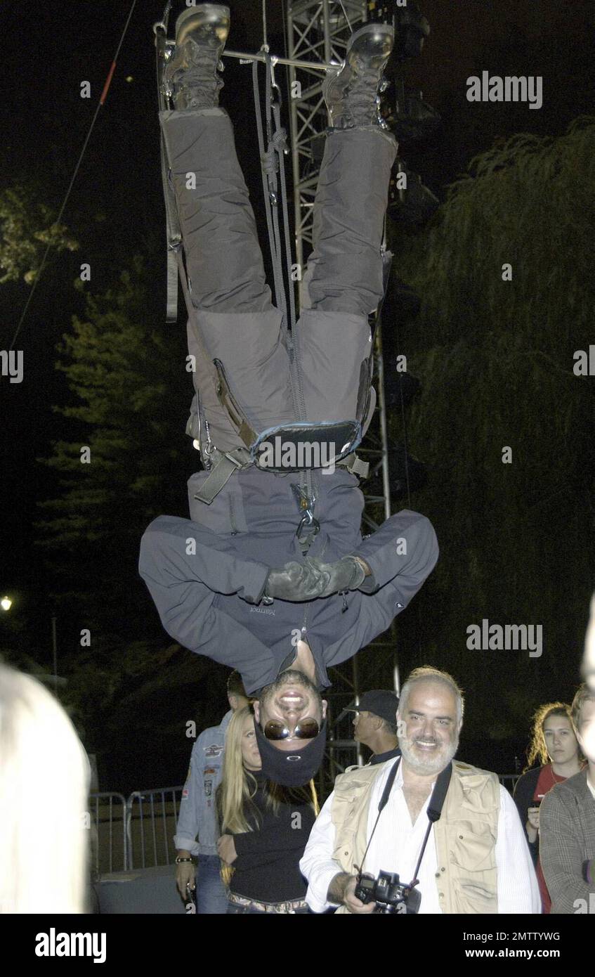 Exclusive!! You gotta have friends...especially when you're constantly attempting death-defying endurance stunts! David Blaine has begun his latest endurance challenge - hanging upside down for almost three days over the Wollmann Ice Rink in New York city. Blaine's ex-girlfriend and friend, singer Fiona Apple attended the launch of the stunt to make sure David was doing OK and showed great concern as the stunt progressed. Blaine is set to remain in his upside-down state until Wednesday evning despite doctors' concerns about the stress on internal organs and circulation. He is suspended from a Stock Photo