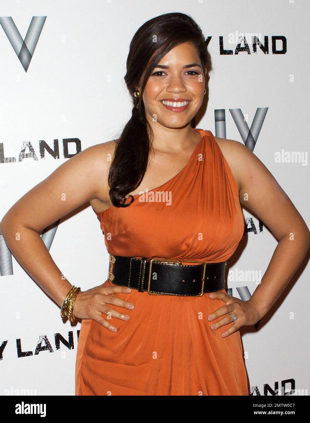 Actress America Ferrera Stands Out Amongst The Men In A Autumn Orange