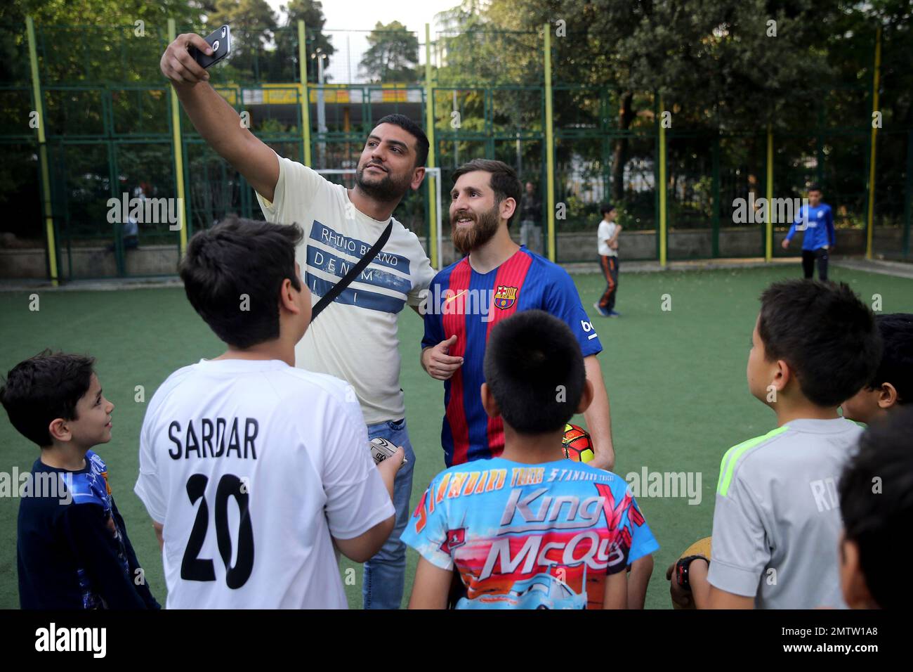 In this Monday, May 8, 2017 photo, an Iranian soccer fan takes a selfie
