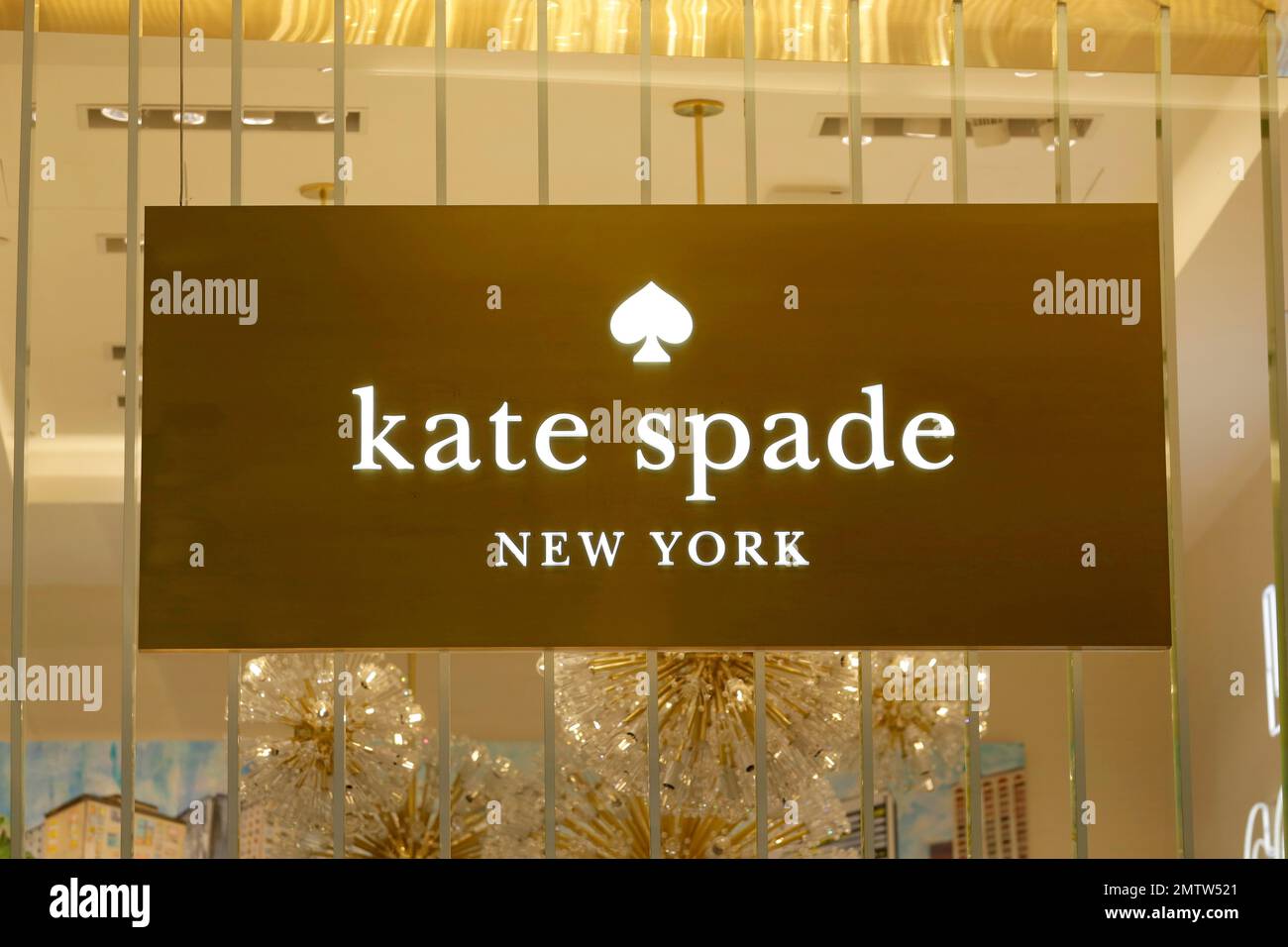 A Kate Spade sign hangs in the window of one of their shops, in New York,  Monday, May 8, 2017. Coach will spend $ billion for Kate Spade, tying  together two premier