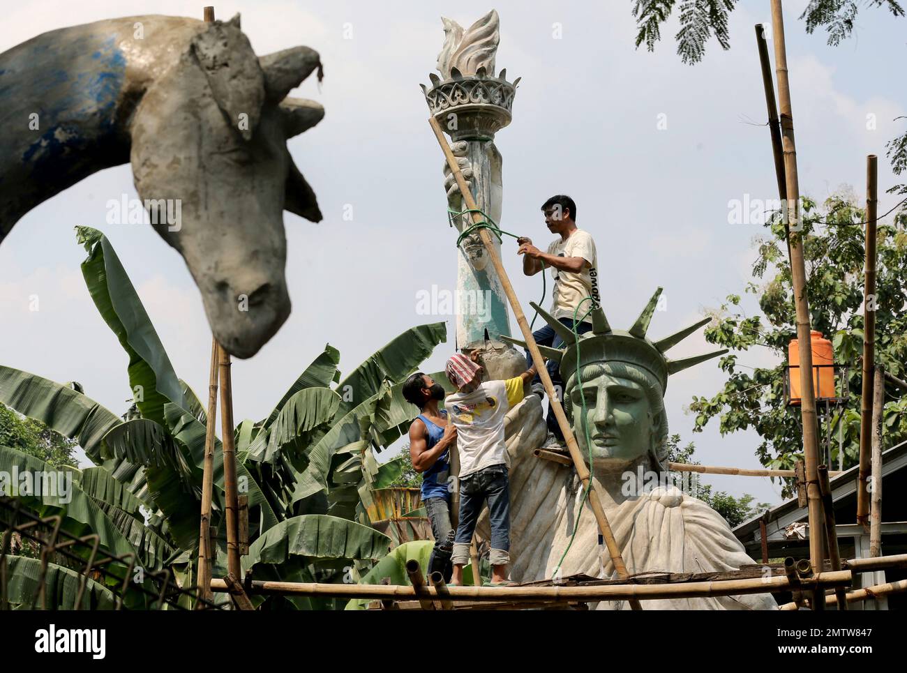 In this Thursday, May 4, 2017, photo, workers build a large replica of