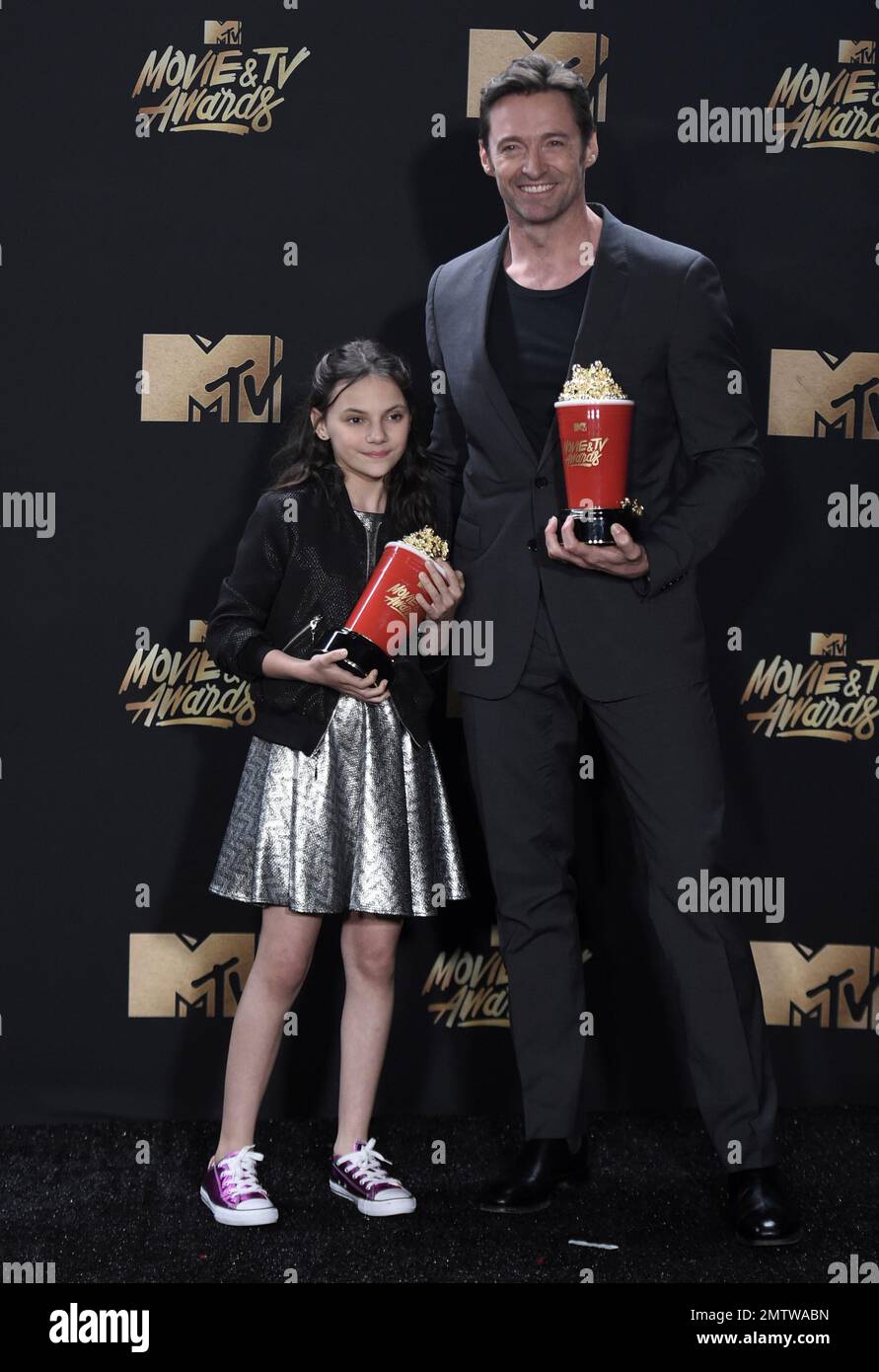 hugh-jackman-left-and-dafne-keen-pose-with-their-awards-for-best-duo