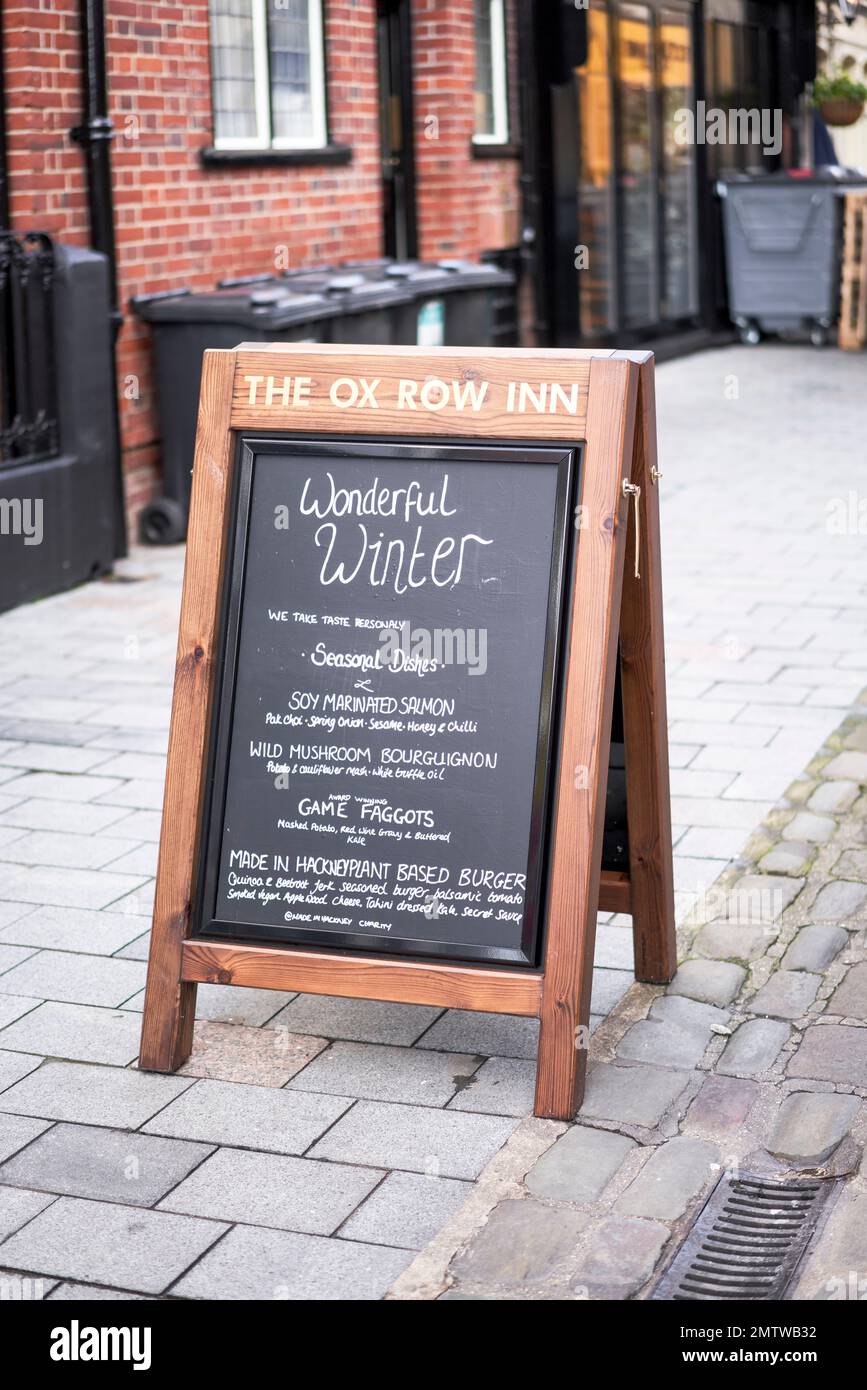 A frame pub restaurant chalkboard advertising sign on pavement Stock Photo Alamy