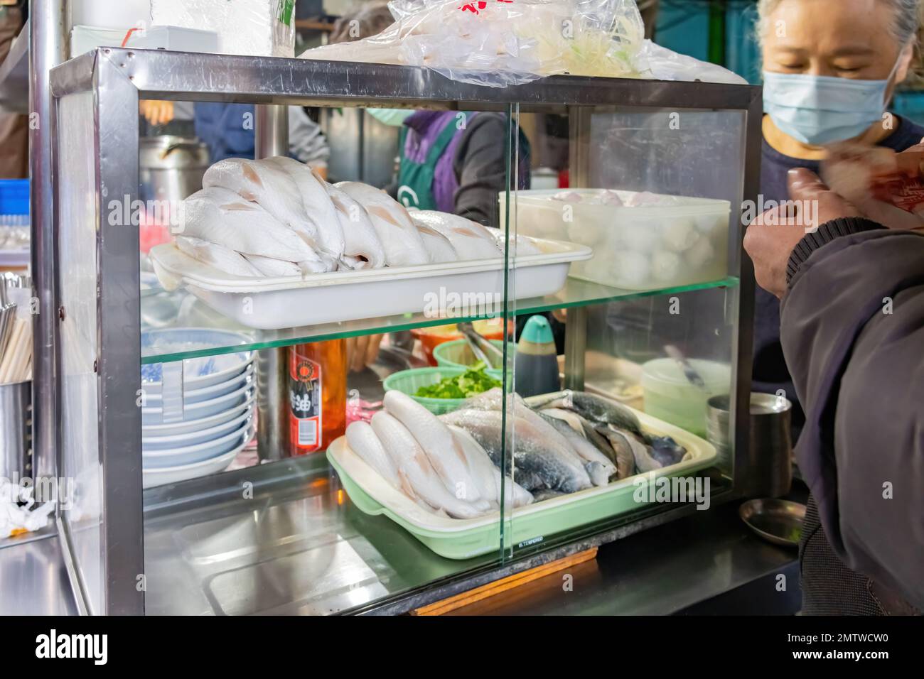 Taipei, DEC 17 2022 - Morning view of a Milkfish street vendor in the traditional Nanjichang Night Market Stock Photo