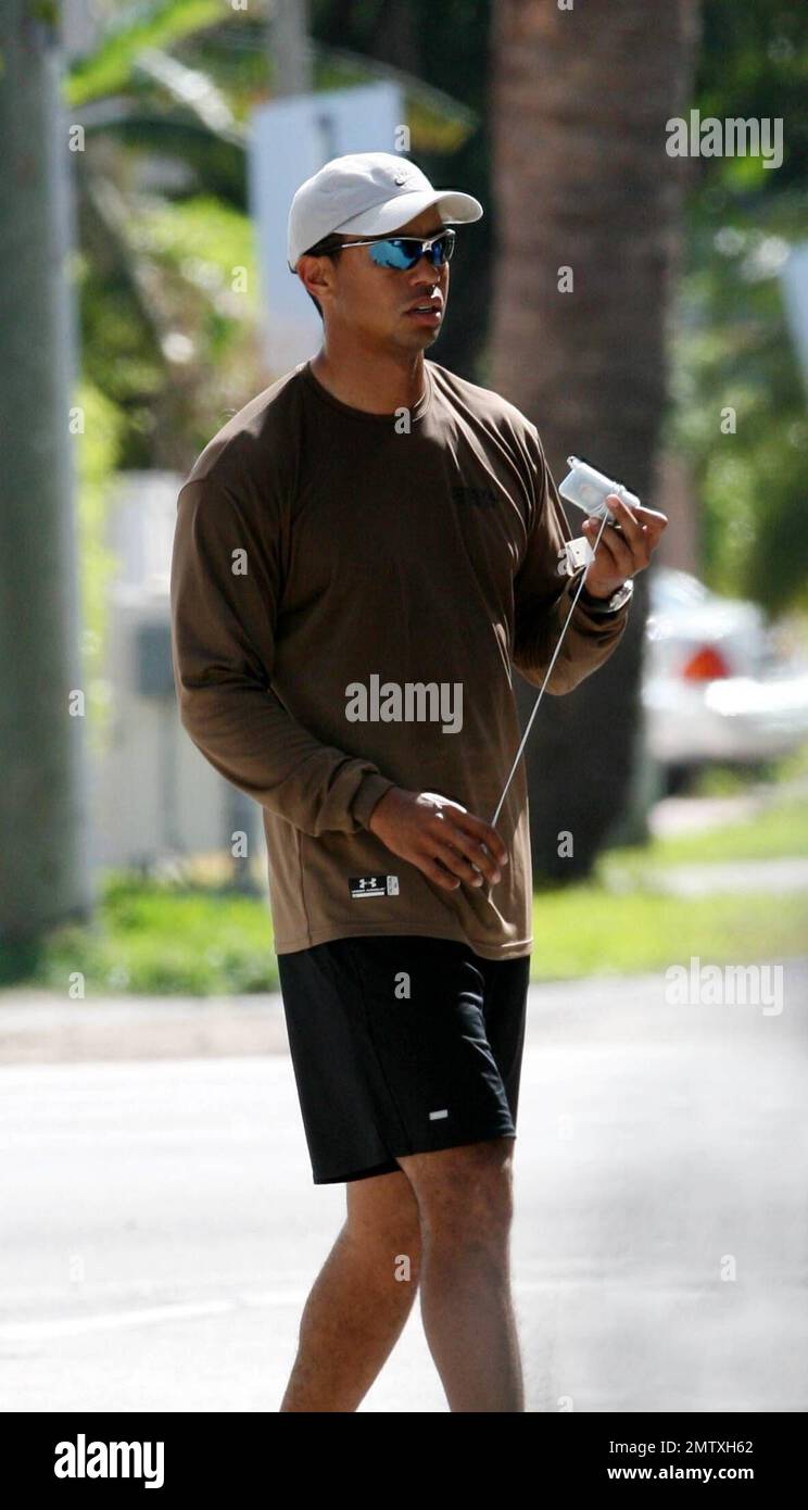 Exclusive!! Golfing superstar Tiger Woods and wife Elin take a break from their yacht 'Privacy' to go to a local gym. Even though Elin is pregnant and showing, she still likes to work out and keep in shape. Miami Beach, FL, 3/25/07 Stock Photo