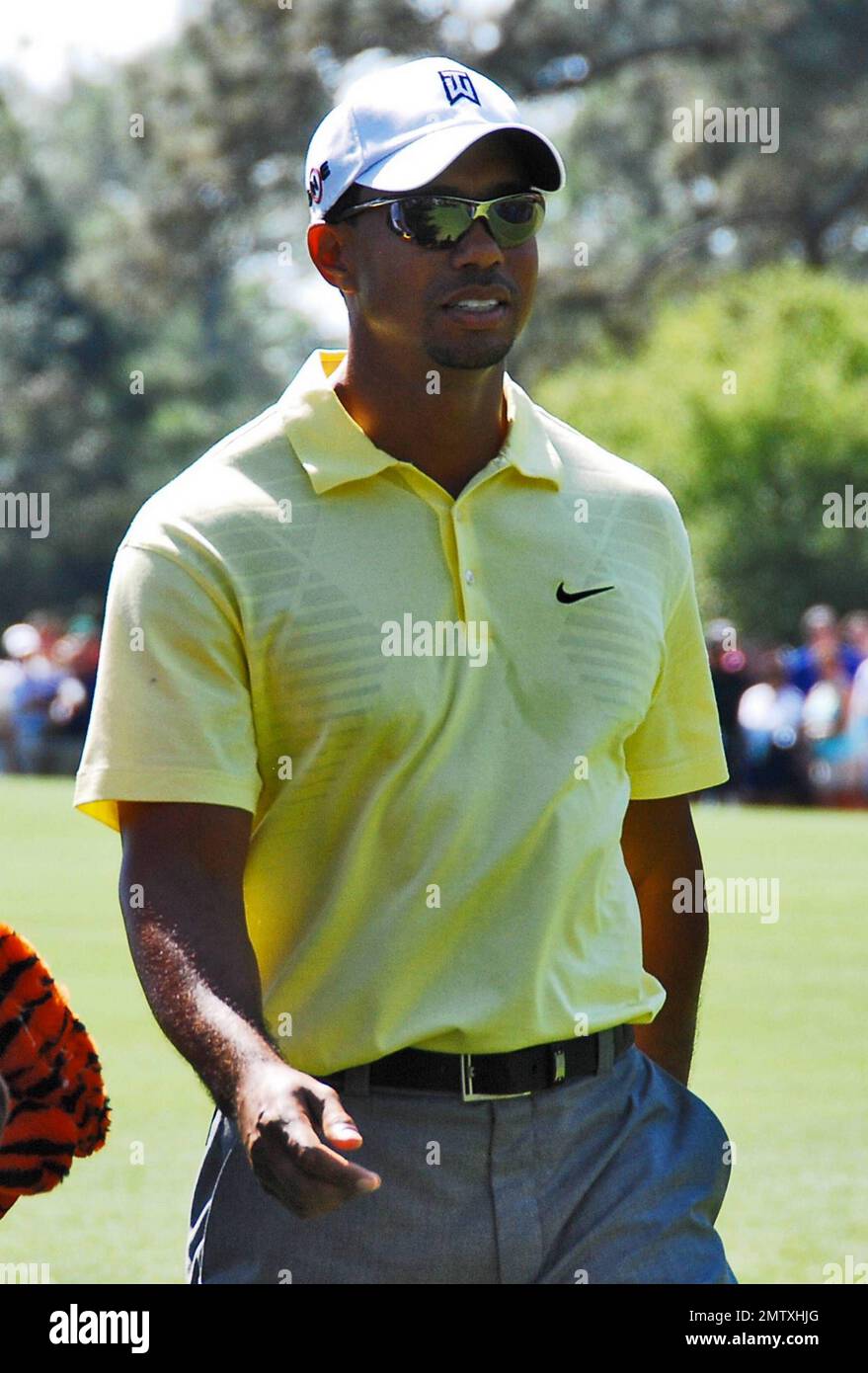 Tiger Woods on the golf course taking time for a practice run during the 2010 Masters Golf Tournament.  This marks Tiger's first time playing golf publicly since news broke about his extramarital affairs in November 2009. Augusta, GA. 04/06/10.   . Stock Photo
