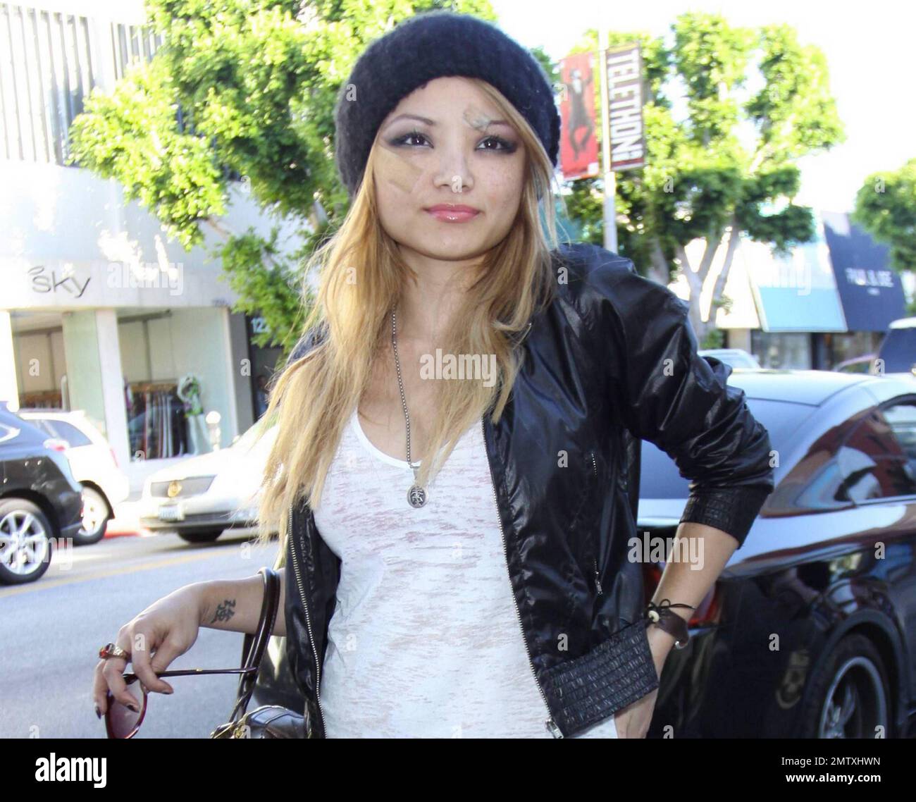 Tila Tequila (Tila Nguyen) poses for photographers as she leaves Kitson