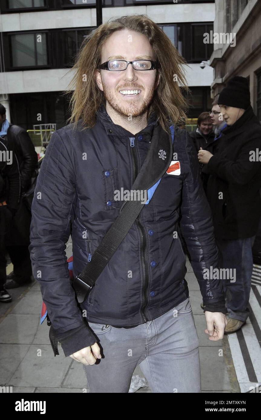 Australian comedian and TV presenter Tim Minchin is all smiles as he arrives at BBC Radio 2, despite recent reports that religious groups are protesting his Christmas song "White Wine In