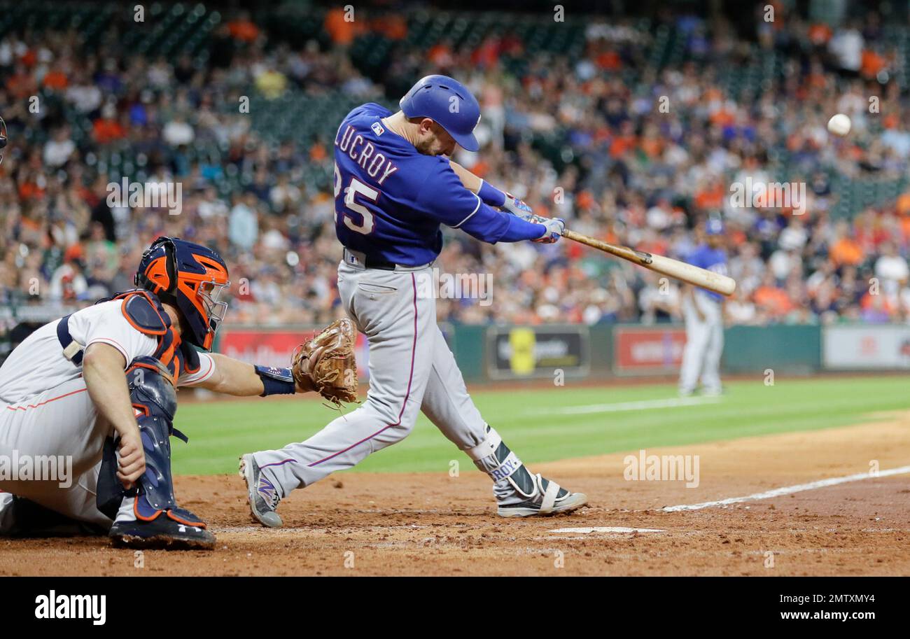 Texas Rangers' Jonathan Lucroy (25) hits a two-run home run as Houston ...