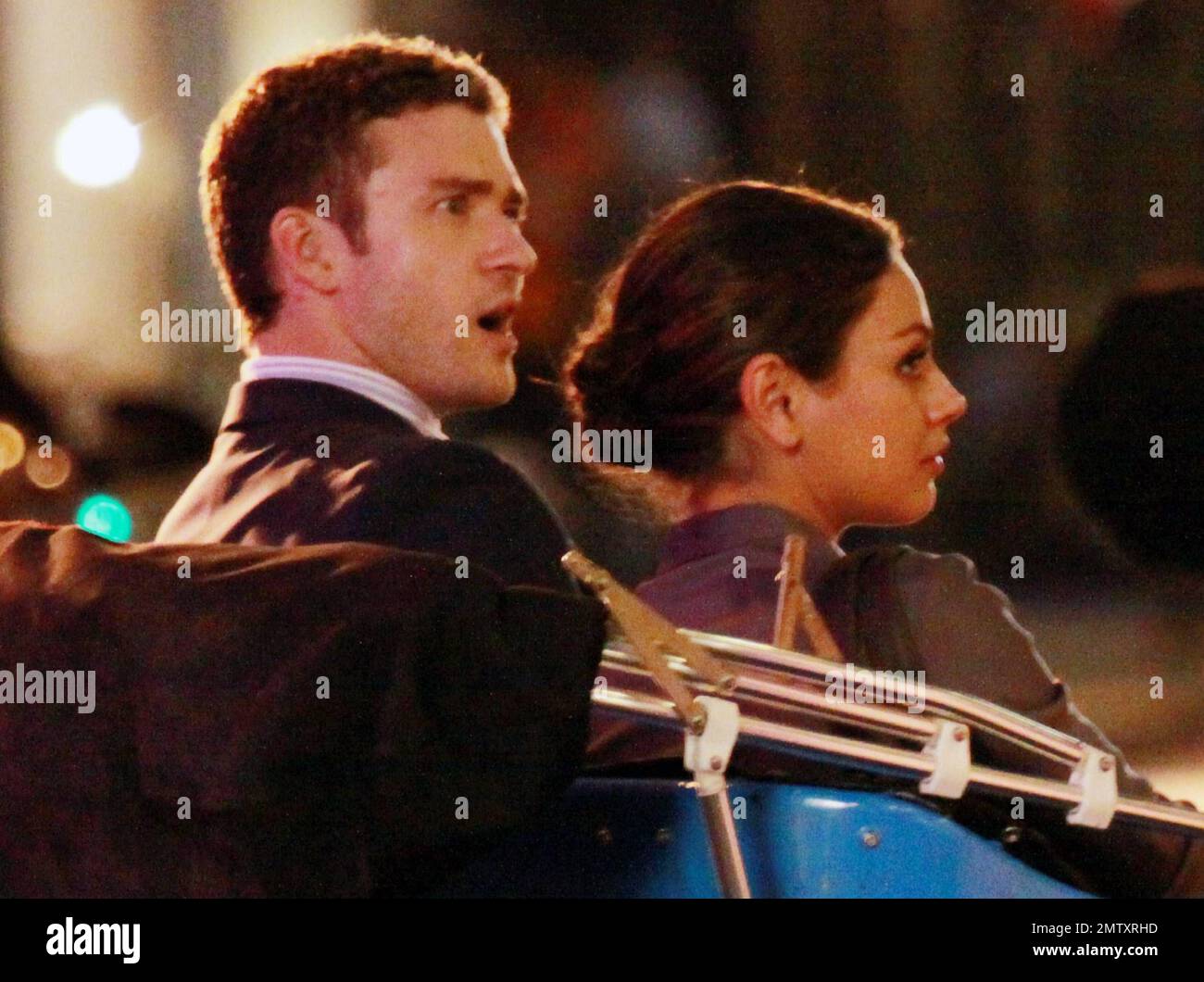 EXCLUSIVE!! Justin Timberlake and Mila Kunis film scenes through the night for the romantic comedy 'Friends with Benefits' at Rockefeller Center.  Before their night scenes the pair were seen on set during the day and wore the same outfits.  Mila and Justin got their makeup done, rode in a rickshaw, Mila shot a scene with a young girl over a chessboard and after they were finished filming Mila untucked her shirt, replaced her heels with flip flops and the pair got in to a waiting SUV.  Also on set was director Will Gluck. New York, NY. 07/25/10.   . Stock Photo