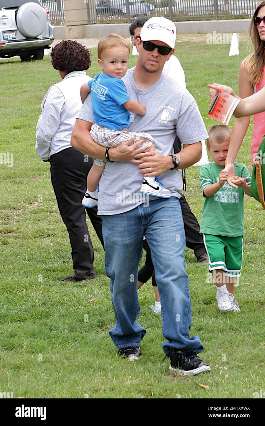 Mark Wahlberg, wife Rhea Durham and sons Brendan and Michael arrive to
