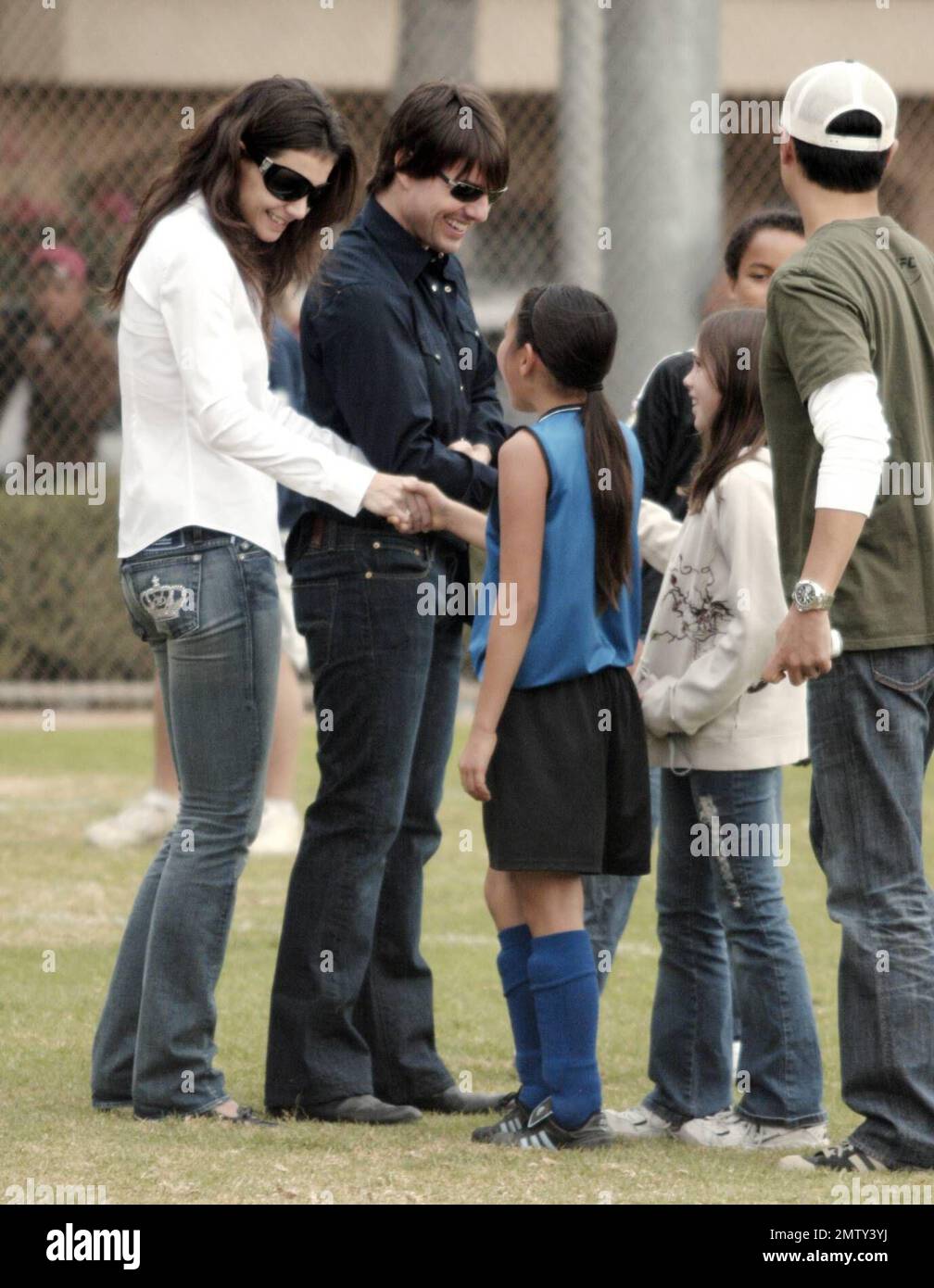 Tom Cruise and Katie Holmes make an appearance at Isabella's soccer match in Beverly Hills, Ca. one week before their wedding in Italy. The couple were very tactile and kept hugging and kissing and smiling throughout the match. Katie was sending and receiving text messages and gave Tom the OK signal after reading one. 11/11/06 Stock Photo