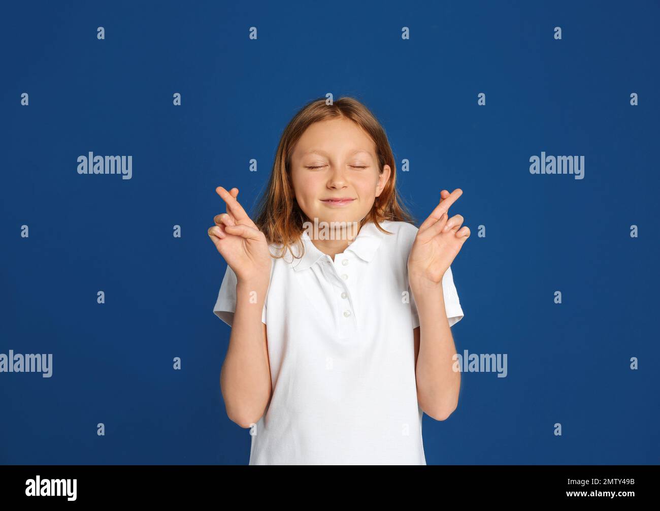 Portrait of emotional preteen girl on blue background Stock Photo - Alamy
