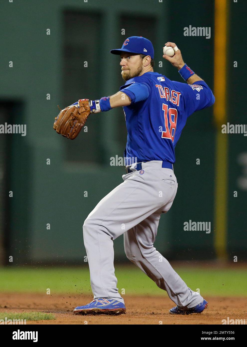 Chicago Cubs' Ben Zobrist throws to first base to complete a double play in  the second inning of a baseball game against the Boston Red Sox, Sunday,  April 30, 2017, in Boston. (