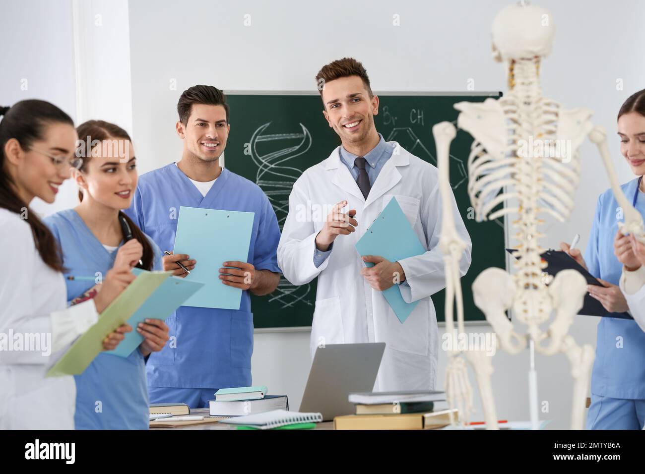 Medical students studying human skeleton anatomy in classroom Stock ... Biology Diagrams