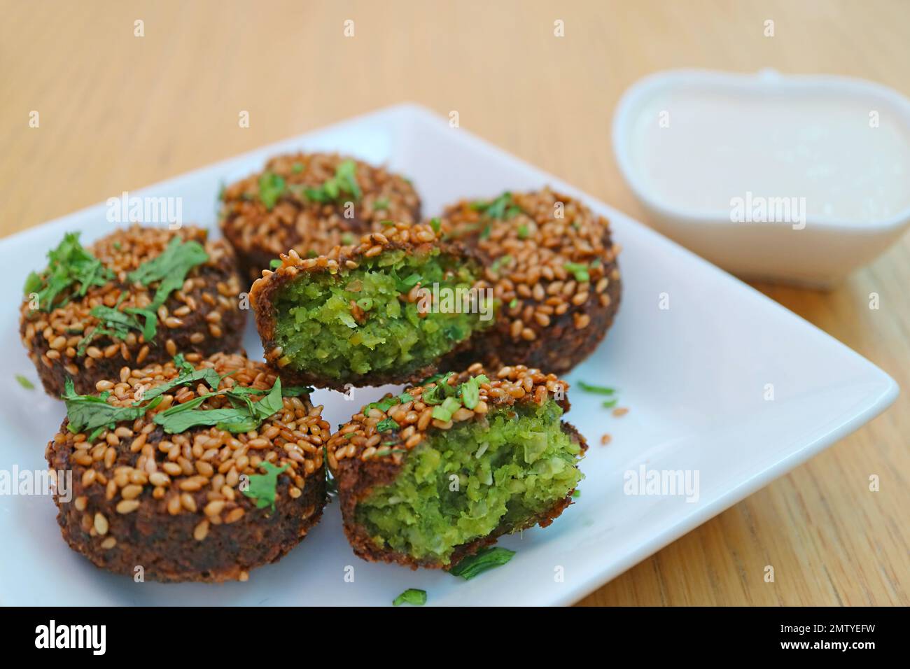 Plate of Delectable Falafels with Yogurt Dip Stock Photo