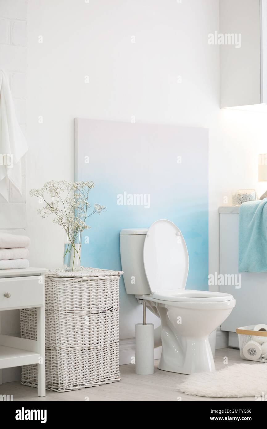 Modern toilet bowl in stylish bathroom interior Stock Photo - Alamy