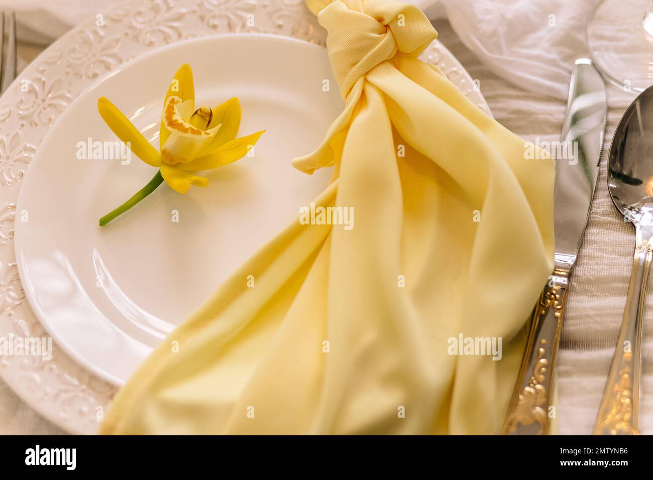 Elegant table setting with floral decor.Beautiful table setting with floral decor Stock Photo