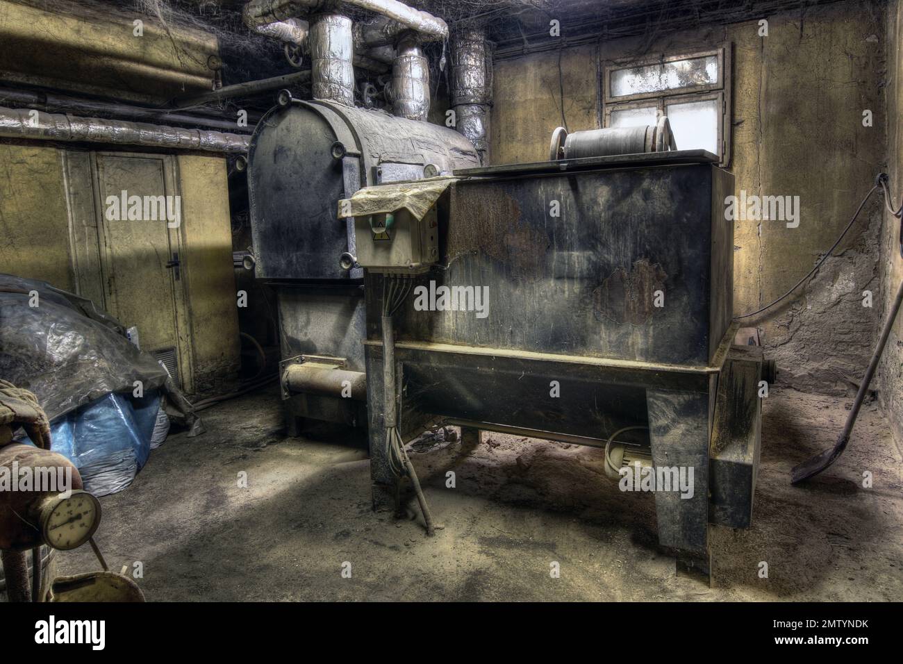 Derelict old machinery room Stock Photo