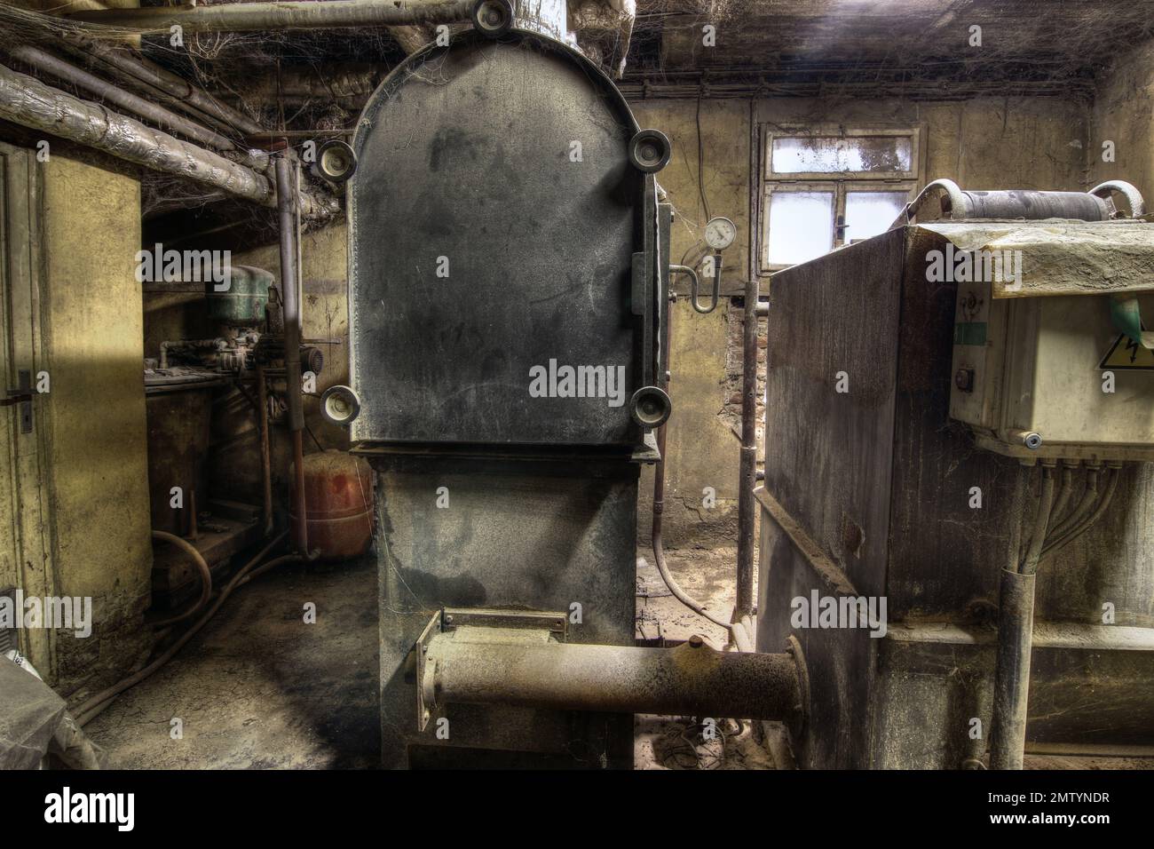 Derelict old machinery room Stock Photo
