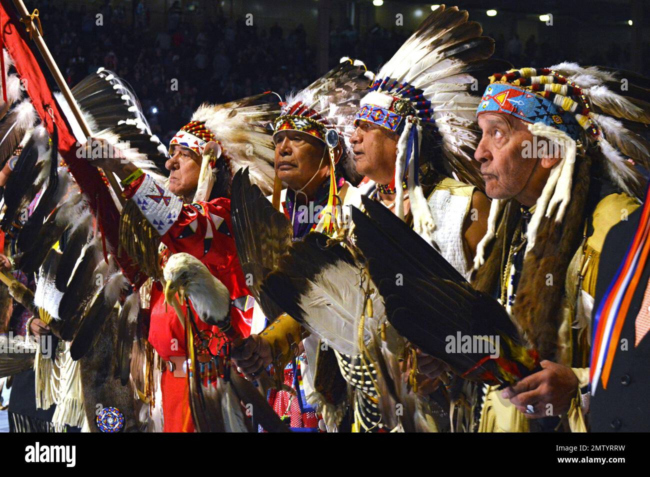 A group of Native American elders lead the grand entry to the Gathering ...