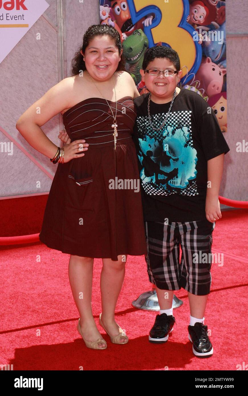 Raini and Rico Rodriguez walk the red carpet at the premiere of 