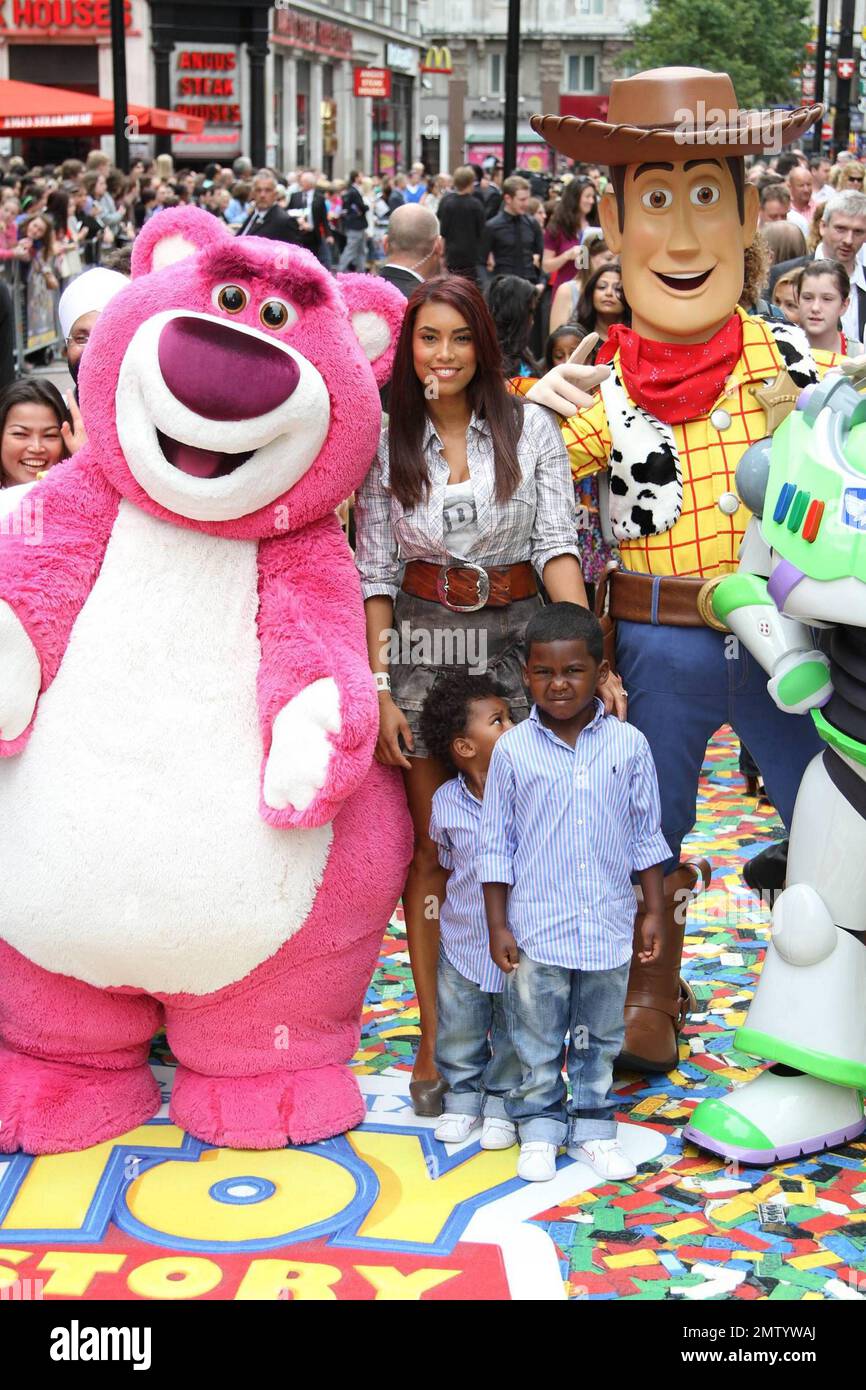 Chantelle Tagoe, fiancee of English footballer Emile Heskey, walks the multicolor carpet with her and Heskey's children at Empire Leicester Square for the UK premiere of Disney and Pixar's 'Toy Story 3'.  The third installment in the Toy Story series has so far received positive reviews since its June release in North America and has proved popular in the toy and video game world with Mattel, Wii, Xbox 360 and PS3 all creating products based on the lovable film characters. London, UK. 07/18/10. Stock Photo